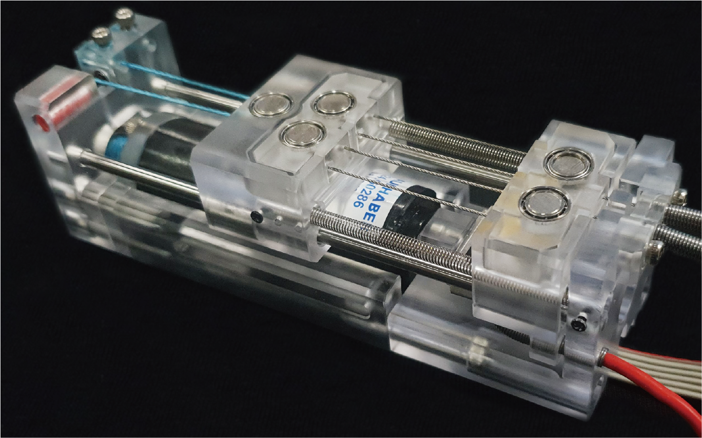 Slider-Tendon Linear Actuator with Under-actuation and Fast-connection for Soft Wearable Robots 